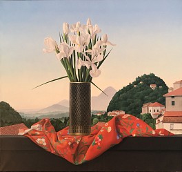 A tall vase of irises is precisely rendered in this large tabletop still-life with images of the Italian alps in the background by James Aponovich.